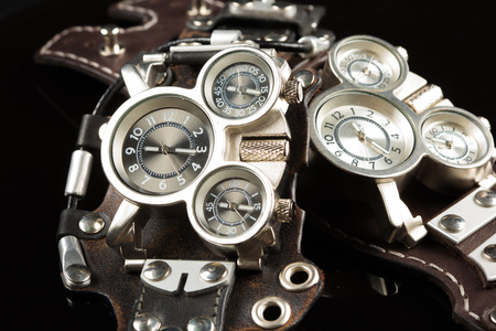 unusual watches. several alternatives dials. wide leather bracelet
