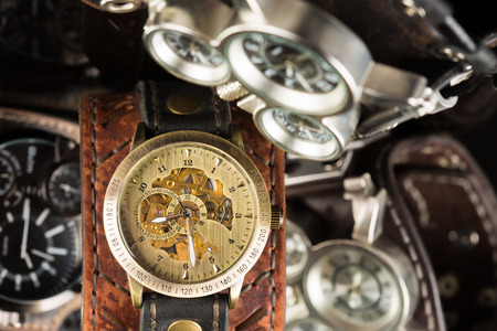 unusual watches. several alternatives dials. wide leather braceletの写真素材