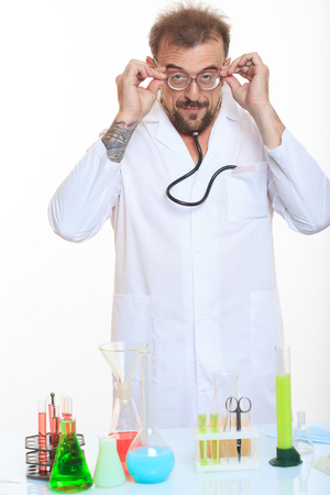 Mad chemist in the lab doing reaction - studio shootの写真素材