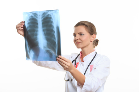 woman doctor holding an x-ray edges. White background