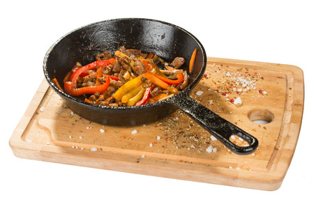 Grilled pork in herbs in frying pan. is on the boardの写真素材