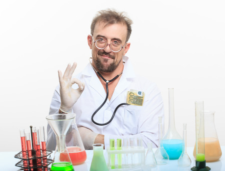 Mad chemist in the lab doing reaction - studio shootの写真素材