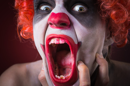 Evil Spooky Clown Portrait on dark backgroundの写真素材