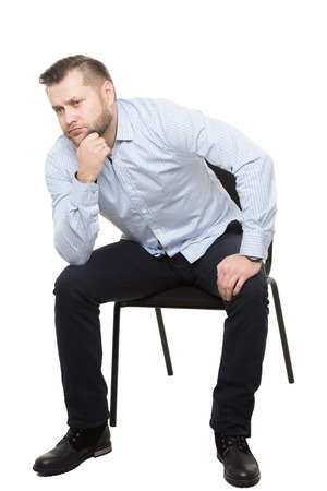 man sitting on chair. Isolated white backgroundの写真素材