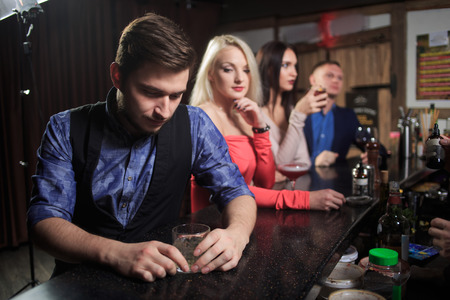 People in the bar. night club. sparklers. sexy women and menの写真素材