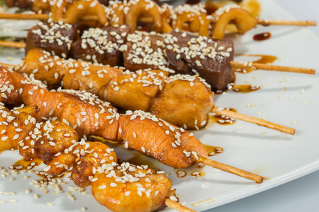 Grilled juicy skewered shashlik on a plateの写真素材