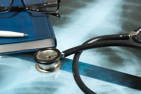 Doctor's desk, medical concept. X-ray and stethoscope.
