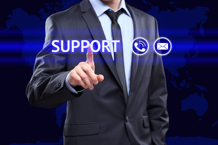 technology, networking concept - businessman pressing support button on virtual screensの写真素材