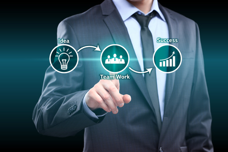 businessman pressing idea team work success virtual button. idea team work success conceptの写真素材