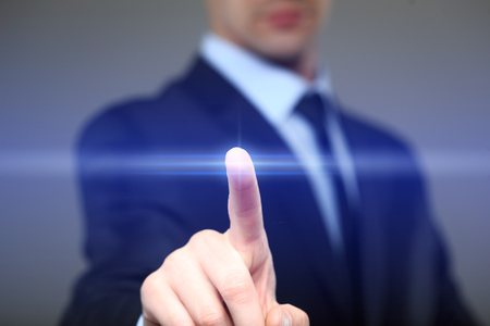 business, technology, internet and networking concept - businessman pressing button with contact on...