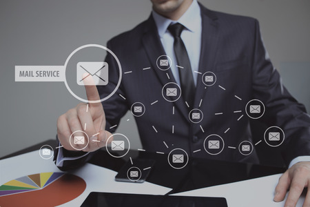 Businessman clicking on email icon. mail service. technology and internet concept.の写真素材