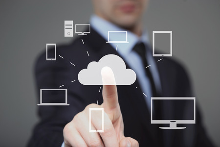 Businessman pressing high tech glowing modern cloud service interface touch screen button