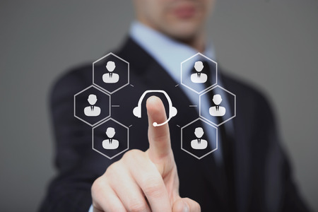 business, technology, internet and networking concept - businessman pressing service button on virtual screensの写真素材
