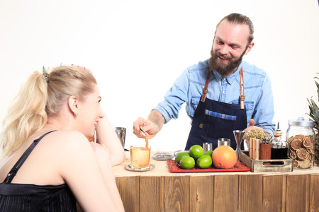 drunk girl clings to the bartenders. Isolated on white backgroundの写真素材