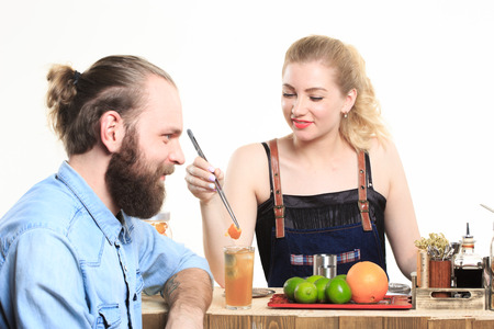 drunk girl clings to the bartenders. Isolated on white backgroundの写真素材