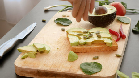 avocado. concept of healthy eating and healthy lifestyle. cooking avocado sandwiches.の写真素材