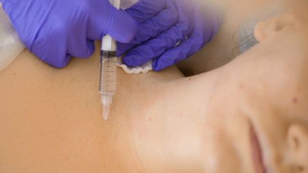The cosmetologist makes injections, anti-aging procedures for tightening and smoothing wrinkles on...