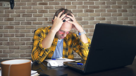a frustrated man cannot concentrate, having a block of writers, a lack of new ideas, or a creative...