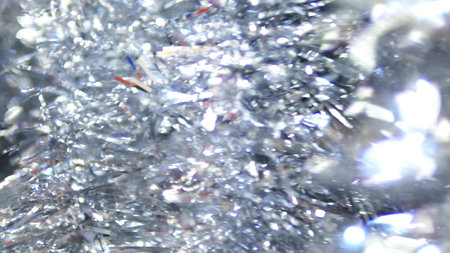 abstract background, shiny christmas tinsel. blur, selective focus. copy space