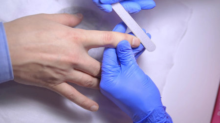 close-up. manicure. deburring scissors. manicure process for men.