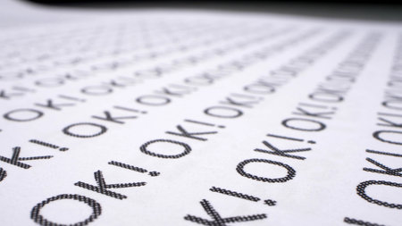 text background. the word ok written many times on a white piece of paper