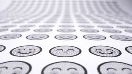background from smiles. icons with smiling faces on a sheet of paper. close-up