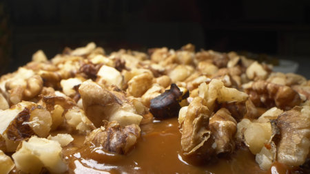 close-up, detailed. chocolate cream and walnuts on the cake. background foodの写真素材