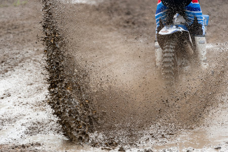 Motocross rider make huge mud splashの写真素材