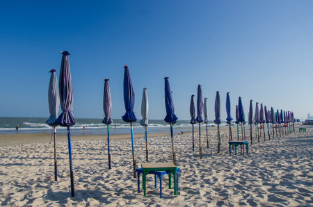 sun umbrellas on beach at evening in Thailand sepia Tone defocusの写真素材