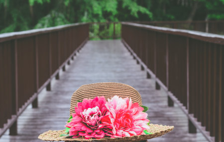 selective focus hat on the wooden bridgeの写真素材