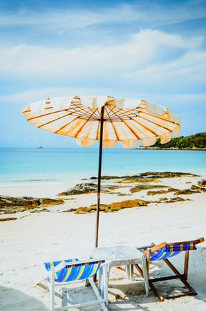 Umbrella and chair on the beach - Vacation and travel conceptの写真素材