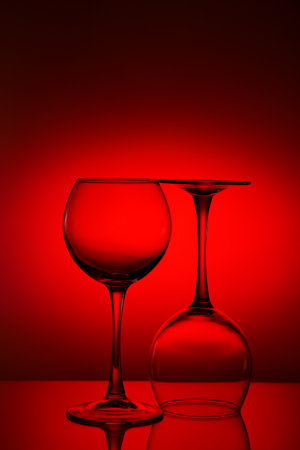 Wine glasses composition on red.のeditorial素材