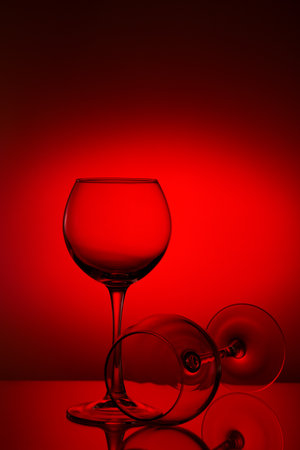 Wine glasses composition on red.のeditorial素材