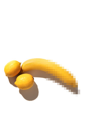 Hidden censored banana and lemons on a white background. like mens penis, male erection and sexual education, comical pornography. potency conceptの写真素材