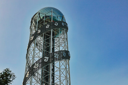 A striking shot of the Alphabet Tower, featuring its unique DNA-like steel structure wrapped with...