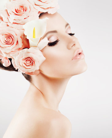 Beautiful lady with a wreath of flowers. Pink rosesの写真素材