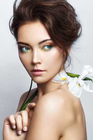 Close-up studio portrait of beautiful woman with bright make-upの写真素材