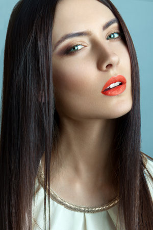 Beautiful young woman with long straight hairの写真素材