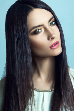 Beautiful young woman with long straight hairの写真素材