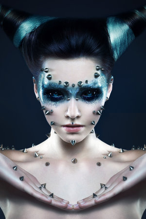 Demon girl with spikes on the face and bodyの写真素材