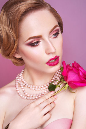 Lady with pink rose の写真素材