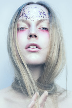 Portrait of the woman with beautiful eyes on white backgroundの写真素材