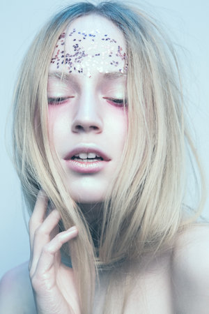 Portrait of the woman with beautiful eyes on white backgroundの写真素材