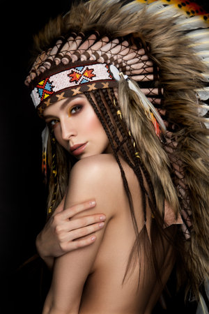 Beautiful ethnic lady with roach on her head. Indianの写真素材