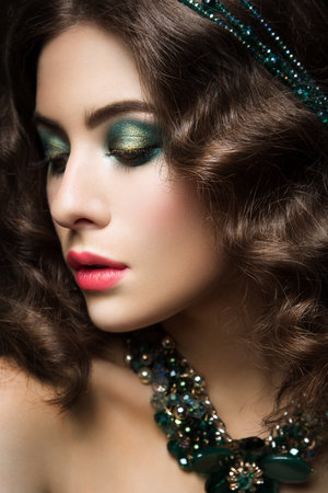 Close-up portrait of beautiful woman with bright make-up and pink lipsの写真素材