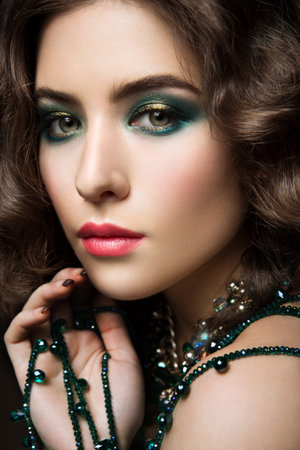Close-up portrait of beautiful woman with bright make-up and pink lipsの写真素材