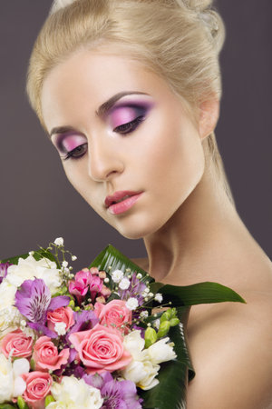 Glamour portrait of beautiful woman model with fresh daily makeup and romantic wavy hairstyle. Fashion shiny highlighter on skin, sexy gloss lips make-up and dark eyebrowsの写真素材