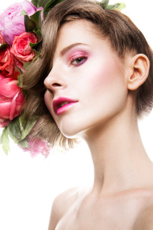 Beautiful lady with a wreath of flowersの写真素材