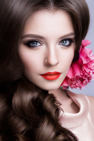 Close-up studio portrait of beautiful woman with bright make-upの写真素材