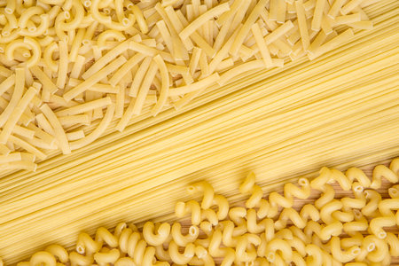 Variety of types and shapes of Italian pasta. Dry pasta backgroundの写真素材